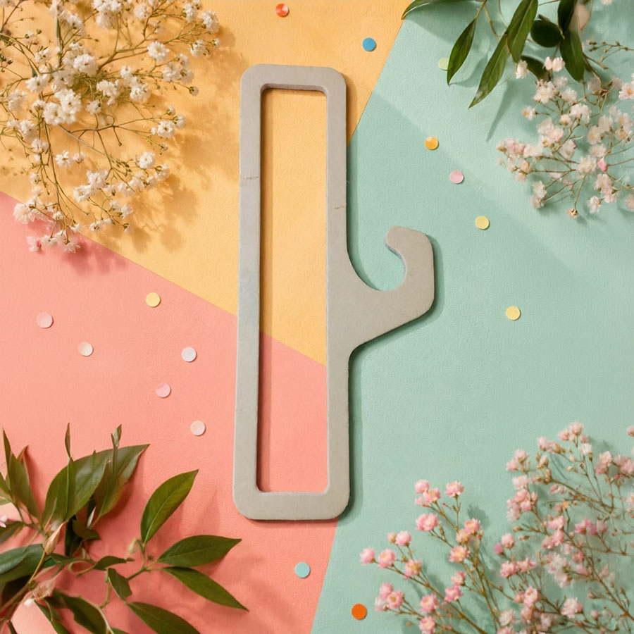 Die-cut custom paper hanger on a pastel display background